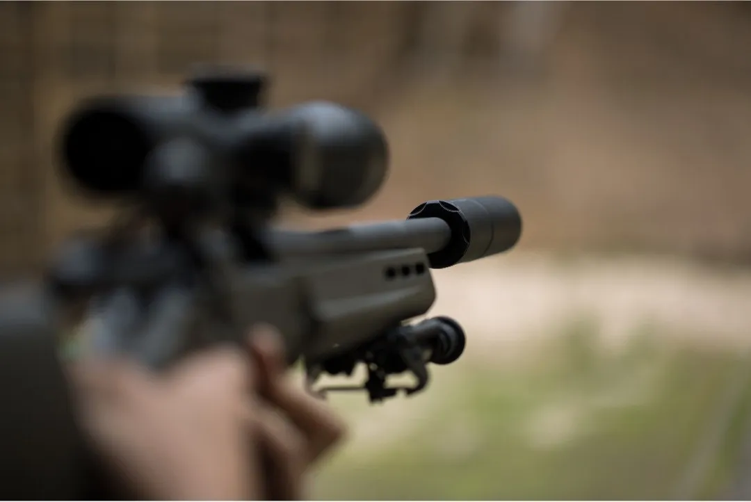 Man holding a rifle depicting firearms training